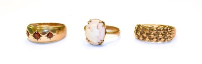 Lot 103 - A 9 carat gold garnet three stone ring, finger size S, a cameo ring, stamped '9CT', finger size...