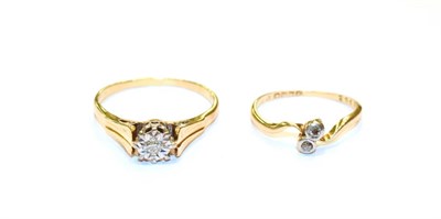 Lot 111 - An 18 carat gold diamond solitaire ring, finger size T and an 18 carat gold diamond two stone twist