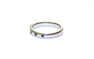 Lot 113 - A platinum sapphire three stone ring, finger size L
