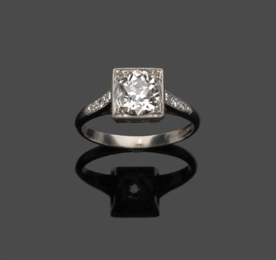 Lot 673 - An Early 20th Century Diamond Solitaire Ring, an old cut diamond within a square millegrain...