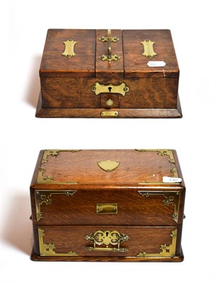 Lot 140 - An oak brass mounted humidor together with a similar cigarette box