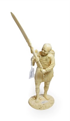 Lot 164 - A Japanese carved ivory figure, circa 1900, applied underneath with plaque engraved with...