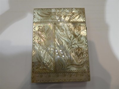 Lot 182 - An ivory card-case, oblong, the cover carved with flowers and a butterfly, the base plain opens...