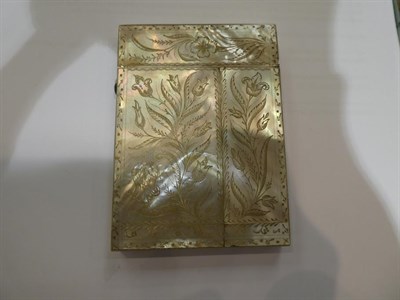 Lot 182 - An ivory card-case, oblong, the cover carved with flowers and a butterfly, the base plain opens...