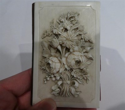 Lot 184 - A carved Ivory card-case/aid-memoire, second half 19th century, oblong, the cover carved in...