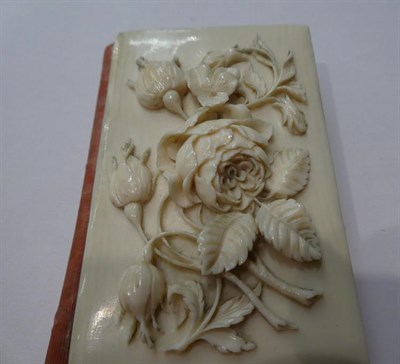 Lot 185 - A Chinese carved Ivory aid-memoire, second half 19th century, oblong, the cover carved with flowers