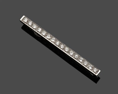 Lot 678 - An 18 Carat White Gold Diamond Bar Brooch, sixteen round brilliant cut diamonds in claw...