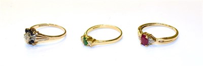 Lot 198 - A ruby and diamond ring, stamped '10K', finger size N, an 18 carat gold emerald and diamond...