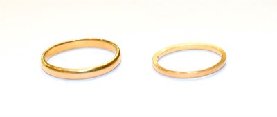 Lot 204 - Two 22 carat gold band rings, out of shape