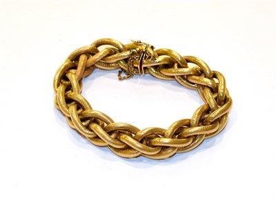 Lot 212 - A yellow textured fancy link bracelet, length 21cm
