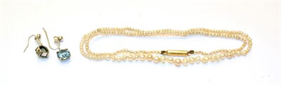Lot 214 - A seed pearl necklace, length 40cm and a pair of blue zircon drop earrings, length 2.1cm
