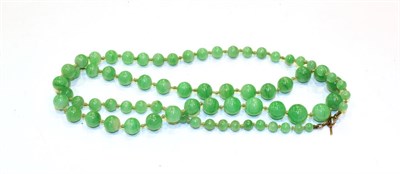 Lot 220 - A graduated jade necklace, length 56cm