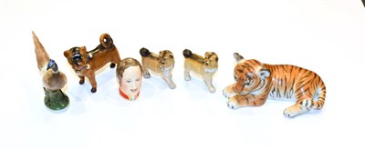 Lot 226 - A Herend figure of a tiger cub, a Rosenthal model of a pheasant, three continental figures of a pug