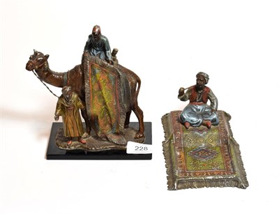 Lot 228 - After Bergmann: An Orientalist style figural table lighter of a camel and rider together with a...