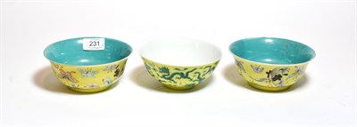 Lot 231 - A pair of Chinese yellow ground bowls, decorated with insects and butterflies, bearing six...