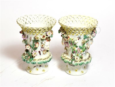 Lot 232 - A pair of Derby basket vases with butterflies and insects, circa 1765 (2)