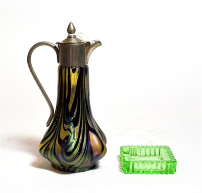 Lot 243 - A small Loetz style glass jug with plated mounts and a green glass ashtray