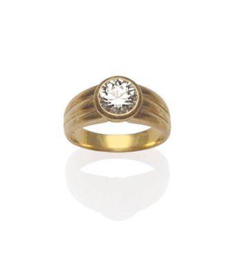 Lot 686 - An 18 Carat Gold Diamond Ring, the round brilliant cut diamond in a rubbed over setting to a...