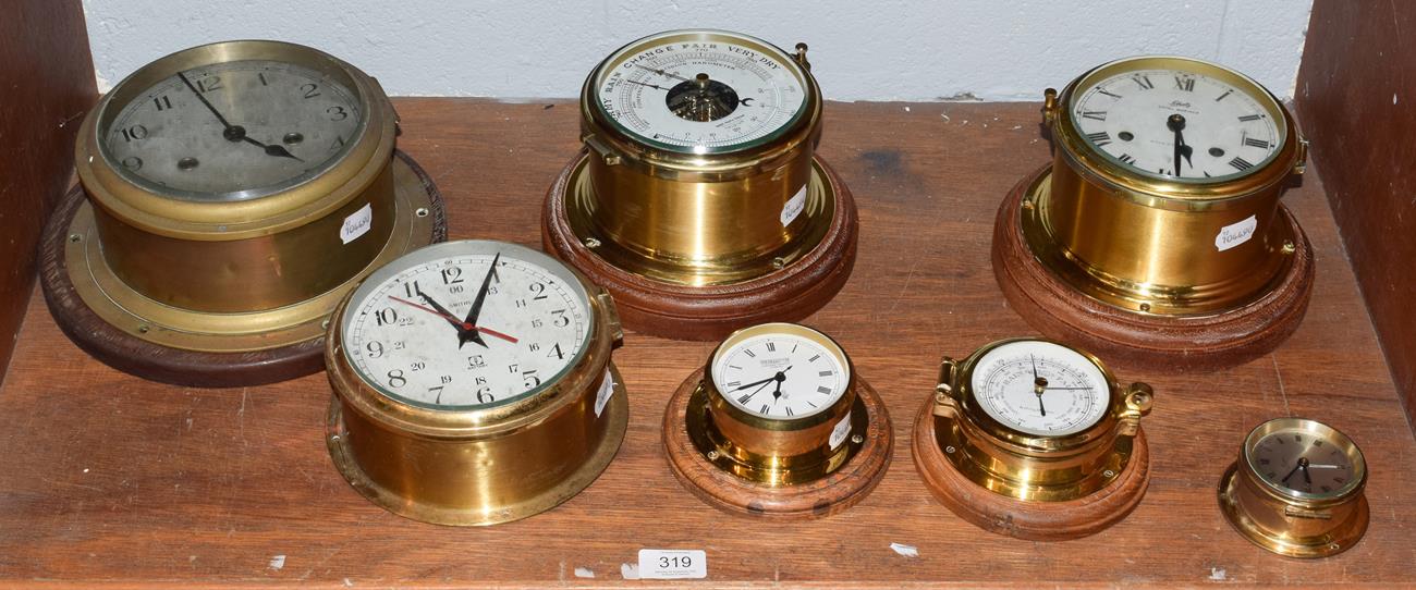 Lot 319 - Five ships type bulk head wall timepieces and two ships type bulk head aneroid barometers (7)
