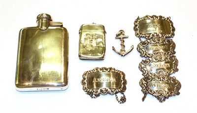 Lot 339 - A quantity of silver, including: a hip-flask; a vesta-case, an anchor pendant and five various...