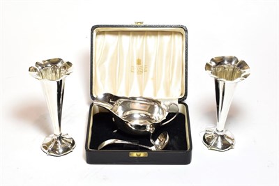 Lot 344 - A pair of Edward VII silver vases, by William Hutton and Sons, Birmingham, 1906, trumpet shaped and