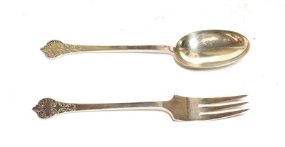 Lot 348 - A George V silver serving spoon and fork, by Thomas Bradbury, Sheffield, 1933, Trefid pattern...