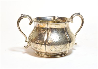 Lot 353 - A Victorian silver sugar bowl, by Robert Hennell, London, 1865, lobed circular and on collet...