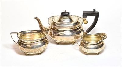 Lot 357 - A three-piece George V silver tea service, by Herbert Edward Barker & Frank Ernest Barker, Chester