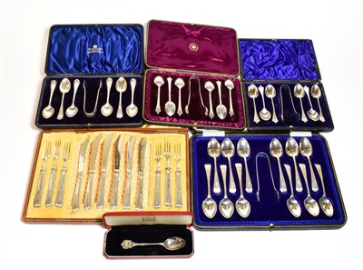 Lot 376 - A collection of cased sets of spoons, including three sets of six teaspoons and sugar tongs, a...