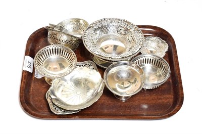 Lot 378 - A quantity of various silver dishes, mostly circular, two with overhead handles, some pierced...