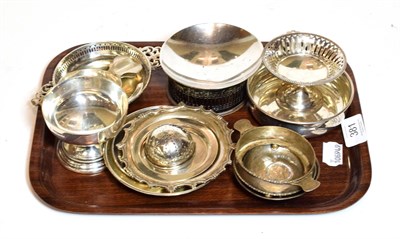 Lot 381 - A collection of assorted silver dishes and bowls, including a font-shaped cup, an American...