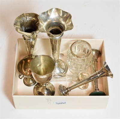 Lot 385 - A collection of assorted silver, including four various trumpet shaped vases, two cups, one...