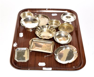 Lot 387 - A collection of assorted silver dishes and ashtrays, variously shaped, one with overhead swing...