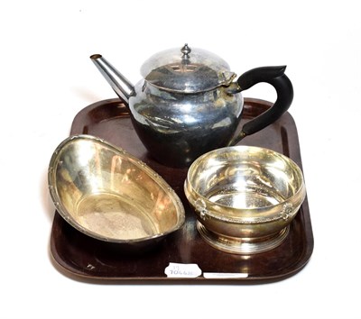 Lot 400 - Three silver items, comprising: a silver teapot, with ebonised wood handle; a navette-shaped...