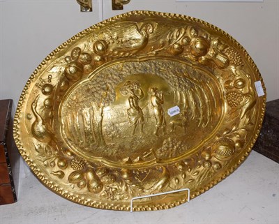 Lot 401 - A gilt-metal charger, in the German late 17th century taste, shaped oval and with crimped rim,...