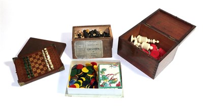 Lot 418 - A 19th century red and white bone chess set, in a mahogany box together with a travelling chess...