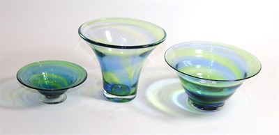 Lot 428 - A 1930's Steven and Williams (Royal Brierley) rainbow glass vase and two bowls, with blue and green