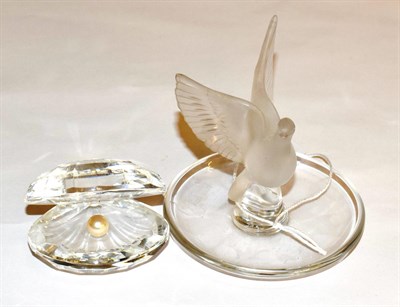 Lot 430 - A Lalique pin tray, modelled as a rising bird and a Swarovski crystal oyster shell (2)