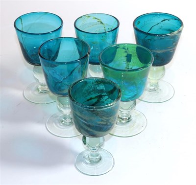 Lot 432 - Eric Dobson for Mdina, six sea and sand goblets, in blue and yellow, clear knop, each signed...