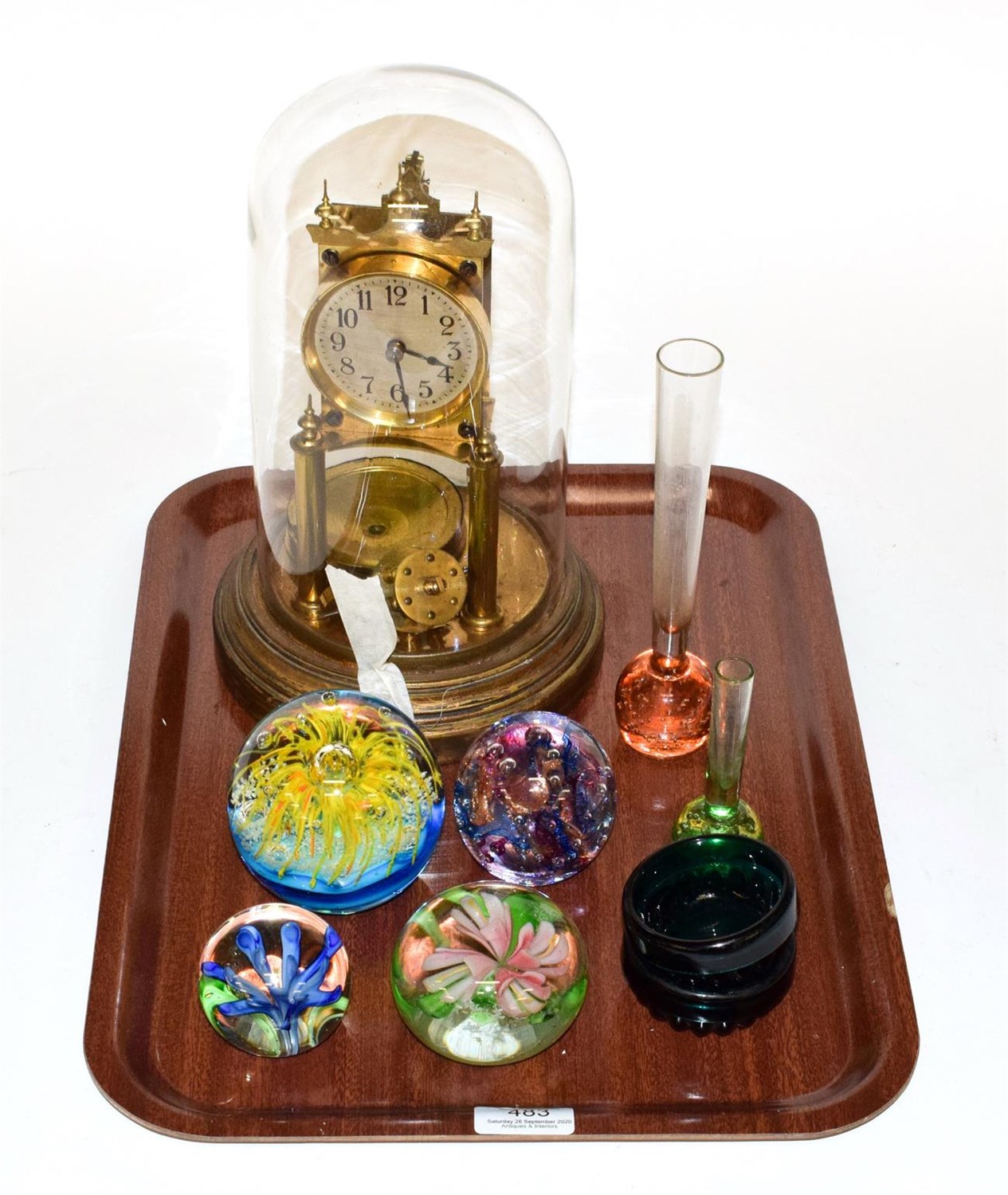 Lot 483 - A 20th century anniversary clock under dome, four glass paper weights, etc (9)