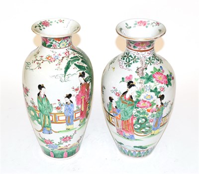 Lot 487 - A pair of 20th century Chinese baluster vases with famille rose decoration of figures in a...