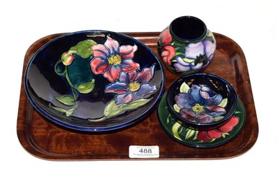 Lot 488 - A Walter Moorcroft clematis footed bowl and three other pieces of Moorcroft pottery