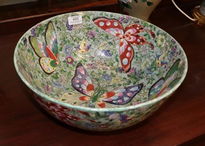 Lot 495 - A late 19th century Japanese bowl decorated with butterflies and flowers, 36cm diameter