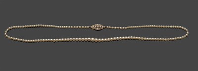 Lot 711 - A Graduated Pearl Necklace, the slightly oval shaped pearls strung to a diamond clasp, length...