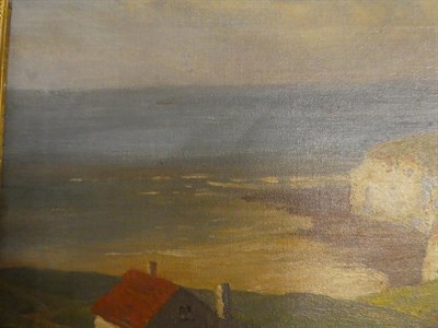Lot 1031 - British School (early 20th century) View of cottages with an extensive seascape beyond,...