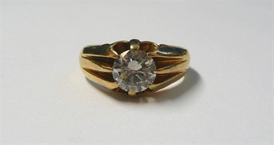 Lot 714 - An 18 Carat Gold Diamond Solitaire Ring, a round brilliant cut diamond in a yellow claw setting...