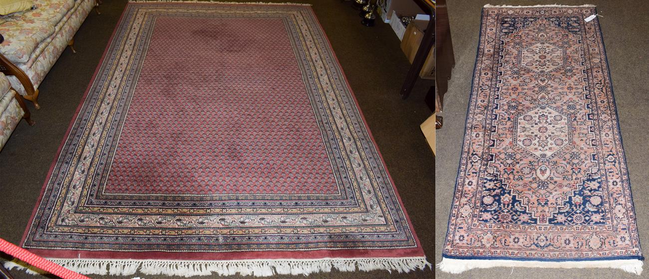 Lot 1086 - Indian carpet of Seraband design, the brick red field of boteh enclosed by multiple narrow borders