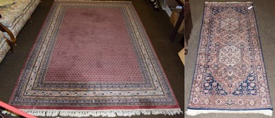 Lot 1086 - Indian carpet of Seraband design, the brick red field of boteh enclosed by multiple narrow borders
