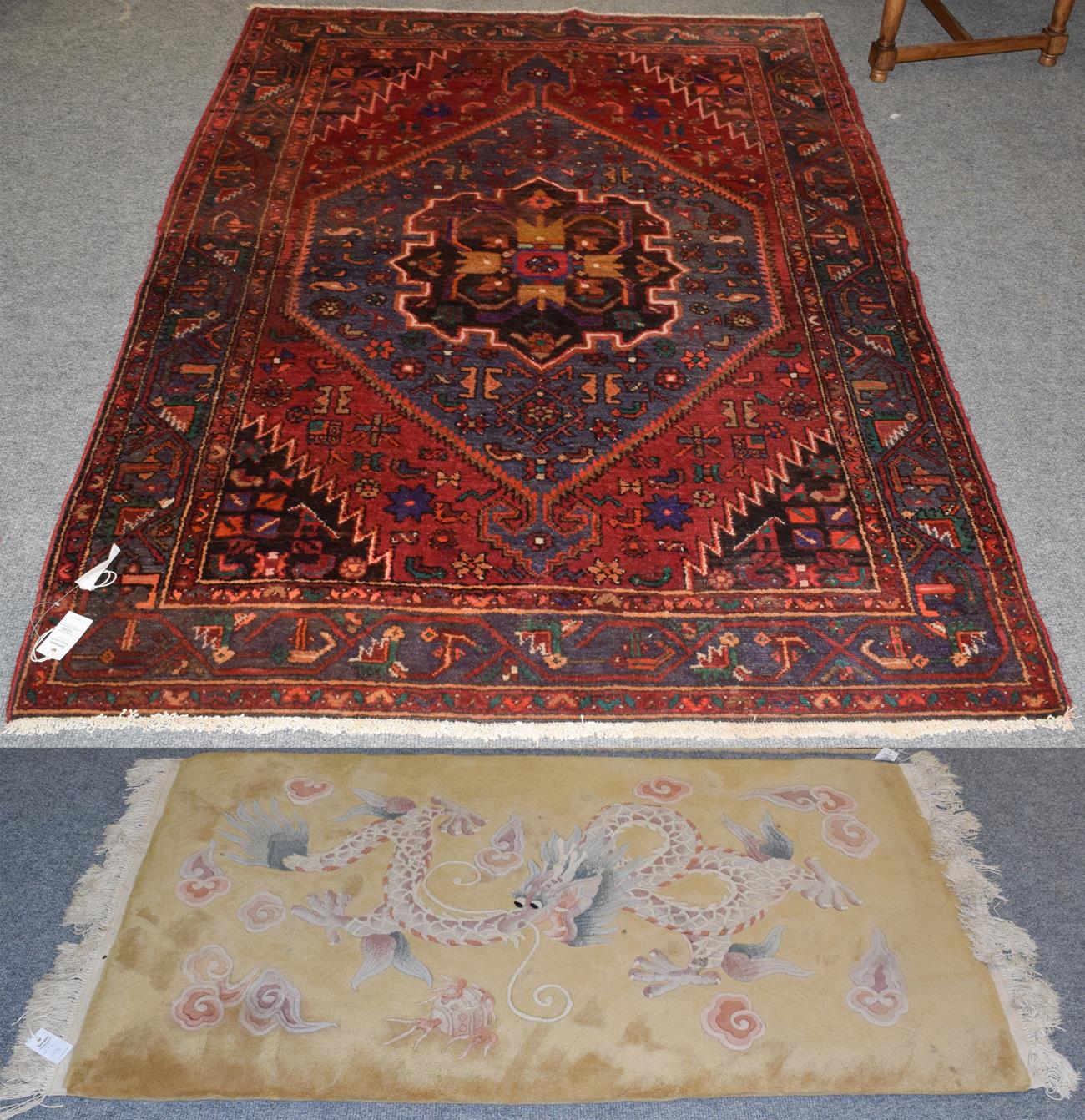 Lot 1096 - Hamadan rug, the scarlet field with lozenge medallion framed by spandrels and angular vine borders