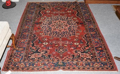Lot 1097 - Bakhtiari rug, the brick red field of vines around a medallion framed by spandrels and mid...